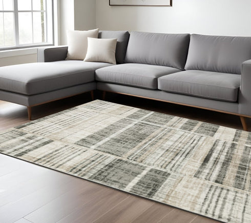 3' X 5' Grey Charcoal Ivory Tan Brown And Beige Geometric Power Loom Stain Resistant Area Rug